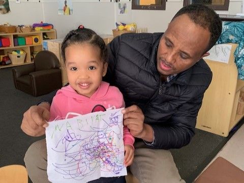 Family-to-Family Volunteers helping sort gifts